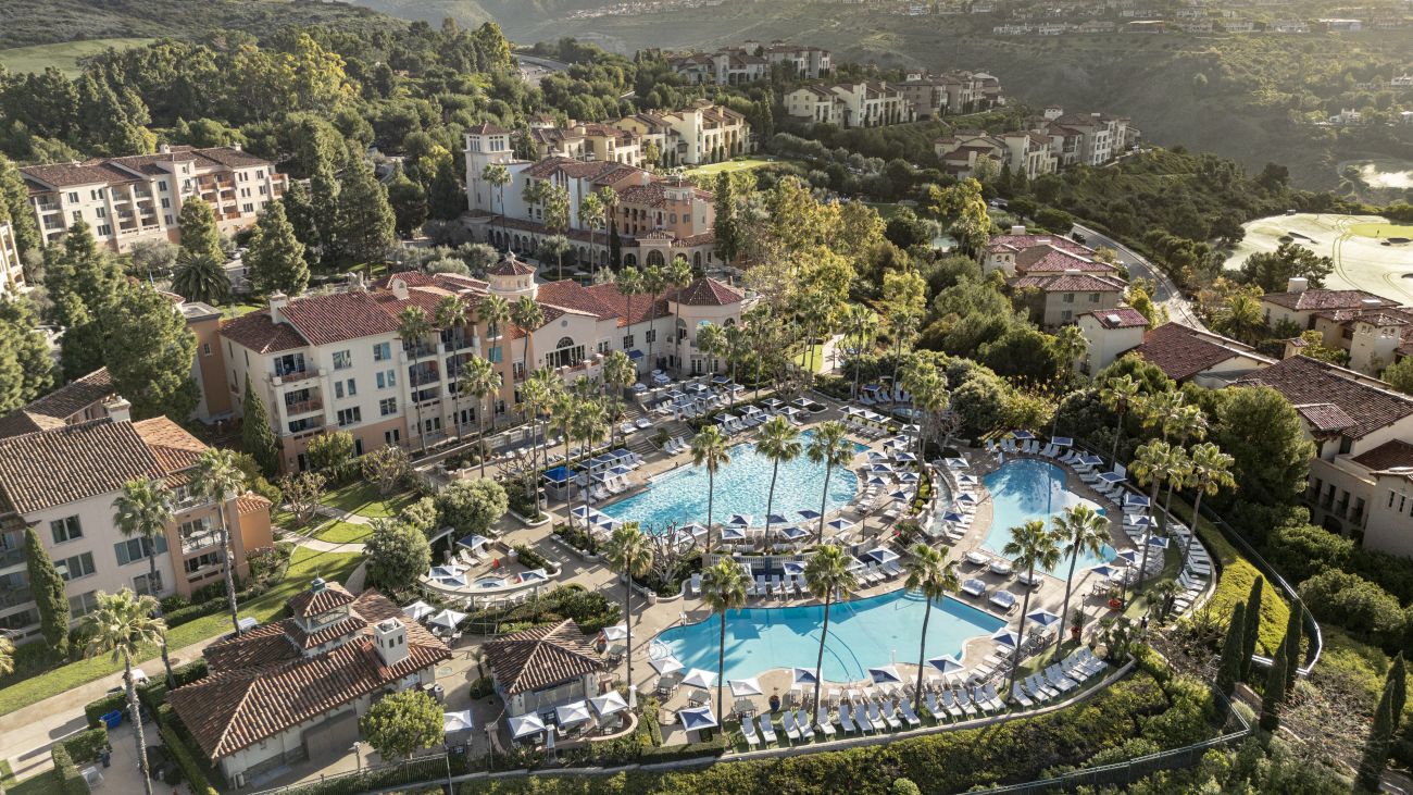 Exterior of Marriott's Newport Coast Villas resort timeshare with sun setting over water